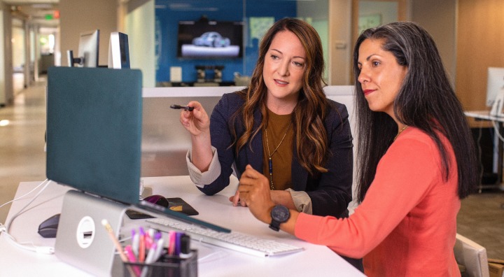 D&M leasing agent and customer reviewing lease terms